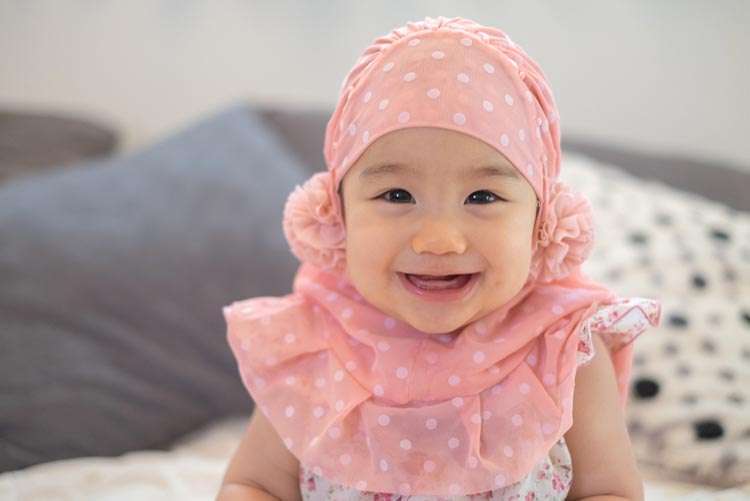 Adorable baby girl wearing a Hijab!