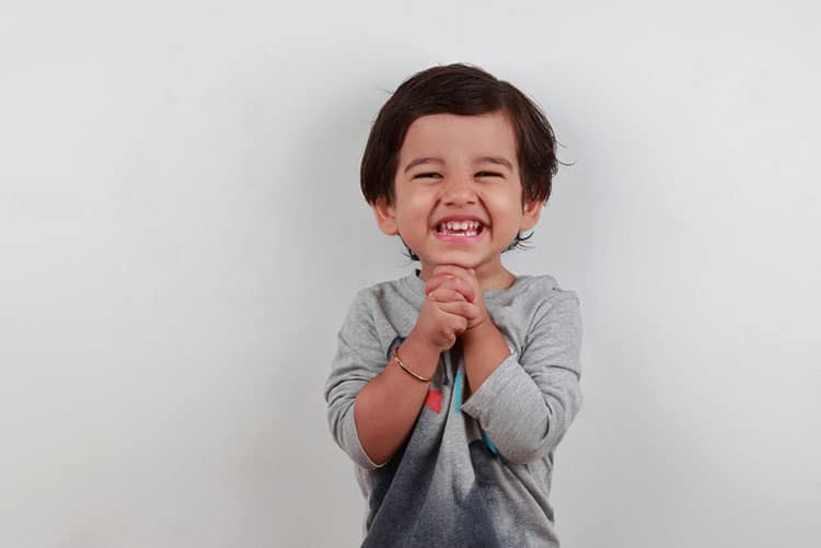 Adorable toddler smiling a toothy smile!