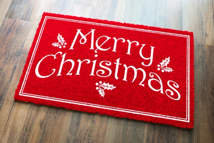 A doormat reading ‘Merry Christmas’