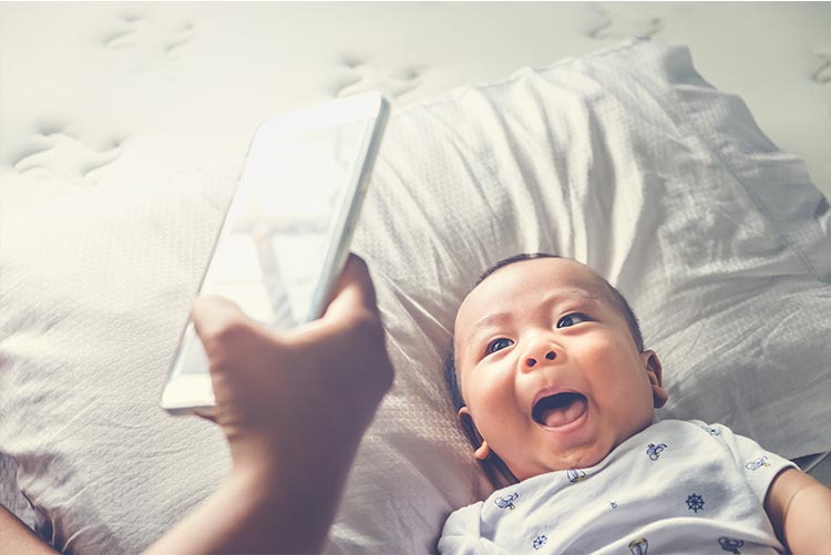 A parent taking a picture of his child.