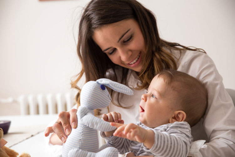 Mom playing with the baby