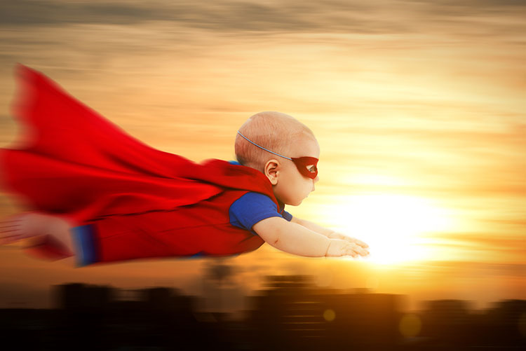 Baby in Superman attire and mask