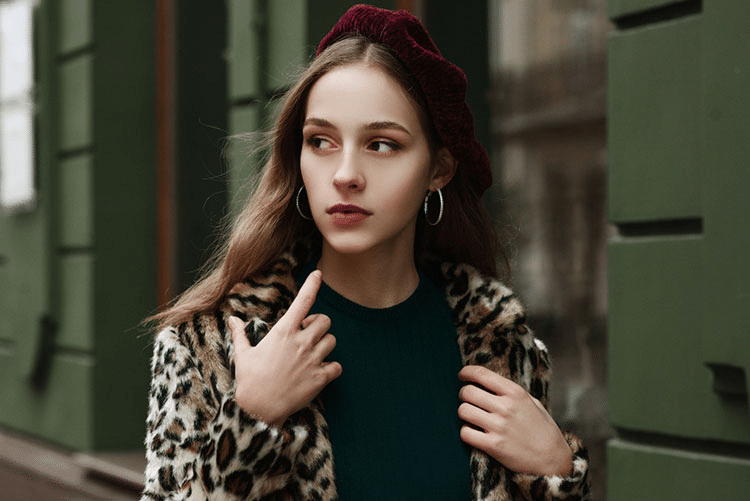 Woman wearing a leopard print blazer and red beret!