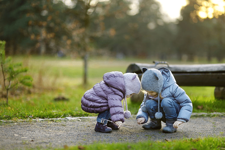 Two sisters in the wintertime, playing outdoors!