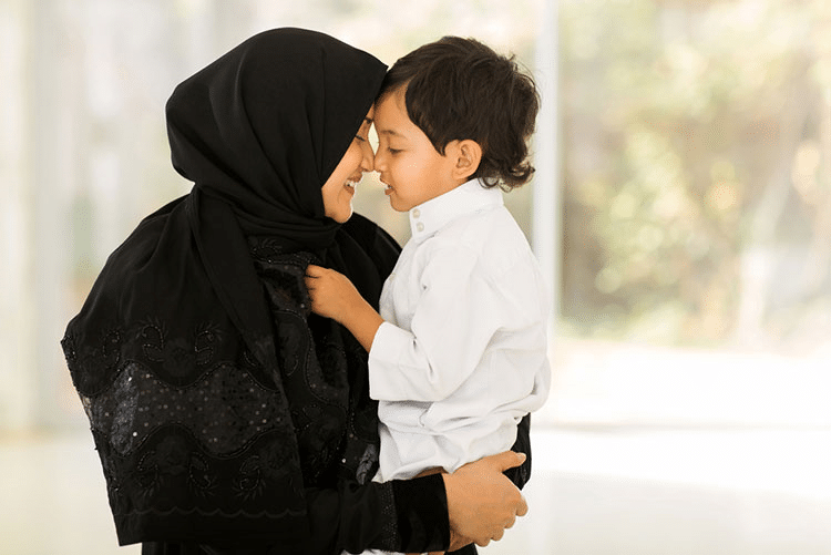 Woman in Hijab holding her son lovingly!