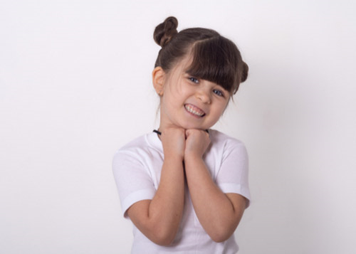 Young girl wearing a white top