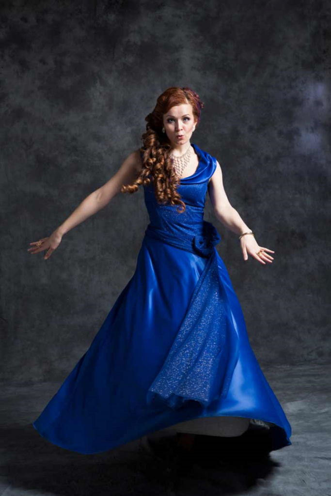 Woman twirling in a Classic Blue princess gown!
