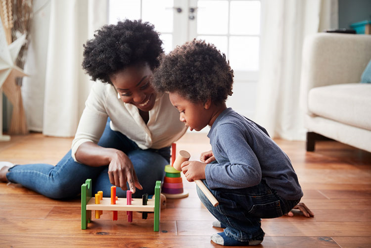 Mother and her toddler playing with a peg toy!