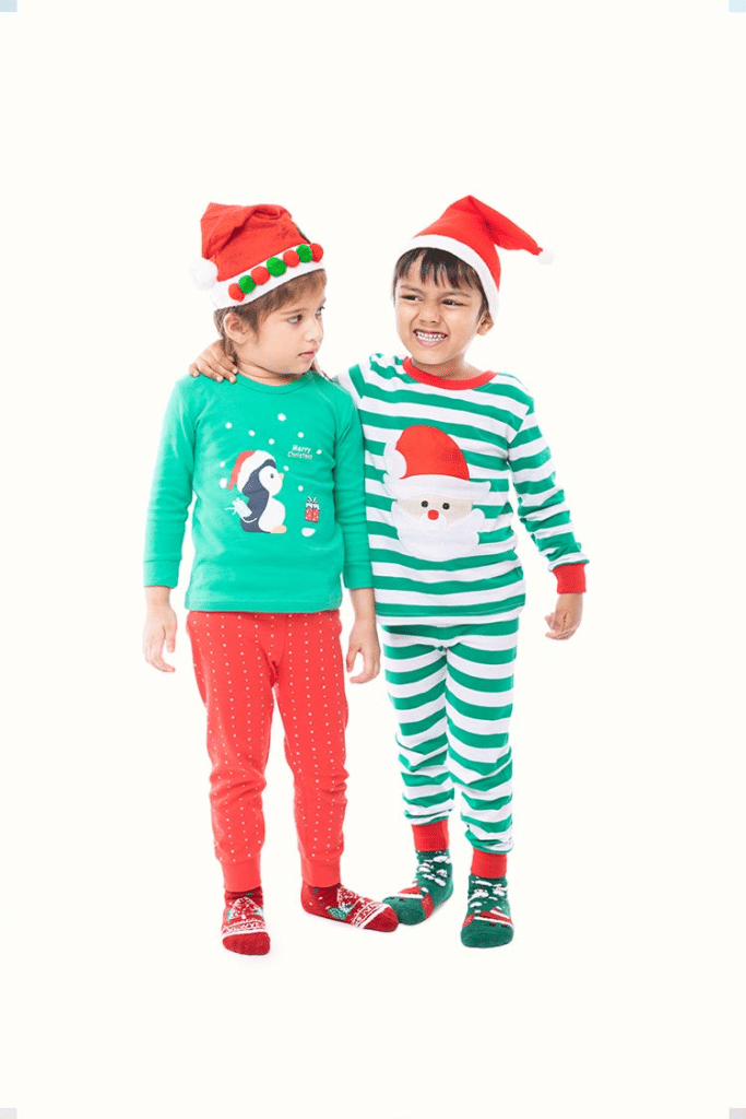 Two adorable kids in Christmas pyjamas and socks!