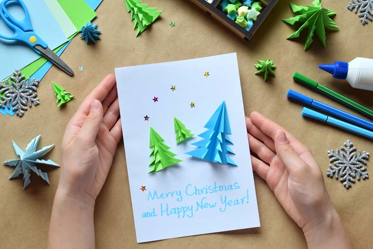 Origami paper embellishments on Christmas card