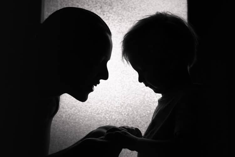 Black and white picture of mom talking to son