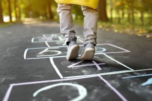 Person hopping through the Hopscotch court