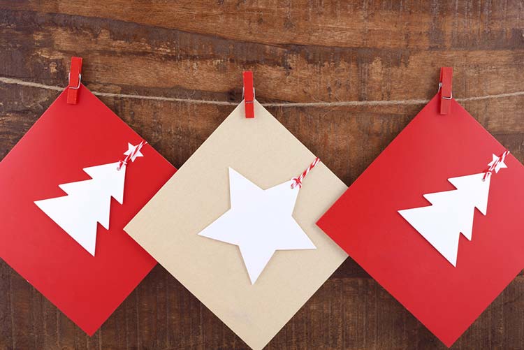 Christmas cards hung on a clothesline