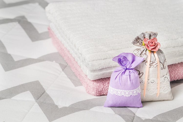 Scented sachets placed against two towels