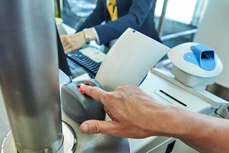 Person scanning their fingerprint