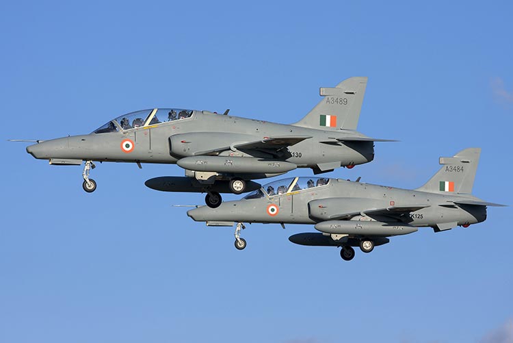 Two Air Force jets flying side by side.