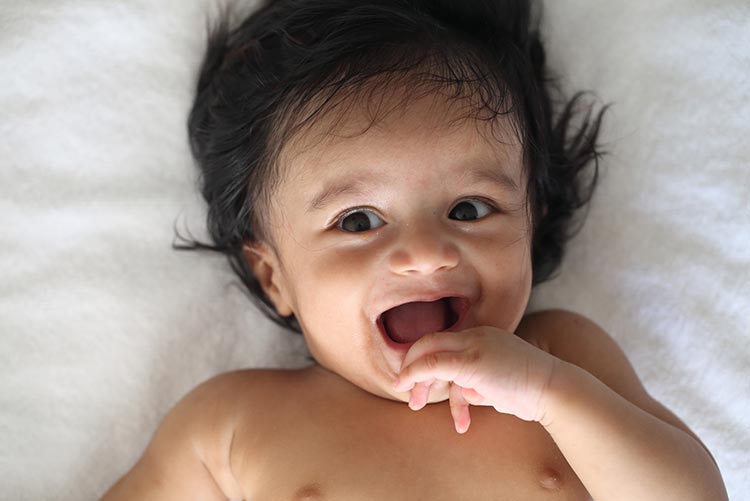 A young boy smiling at the cam.