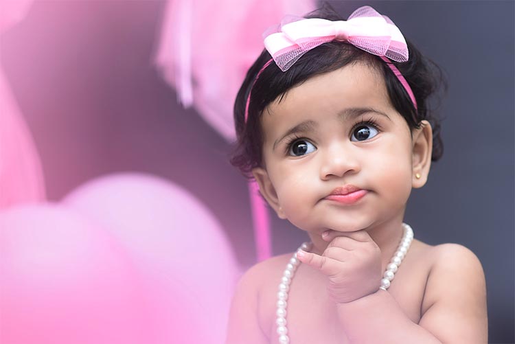 A pretty young girl dressed in pink.