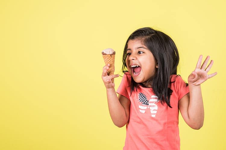 A girl excited to have her ice cream.