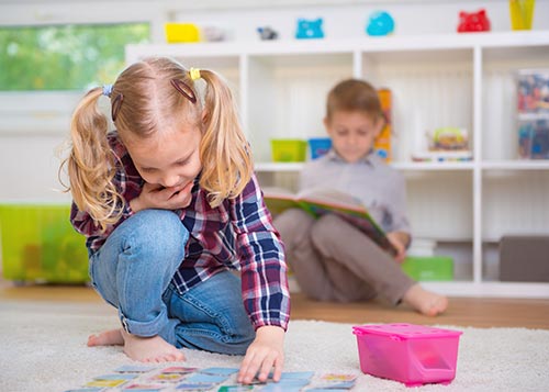 A girl seen playing a game of memory.