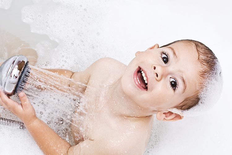 A young boy enjoying his bath time.
