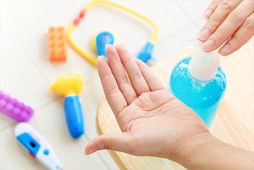 A child using a hand sanitizer.