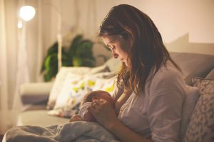 Woman breastfeeding her newborn.