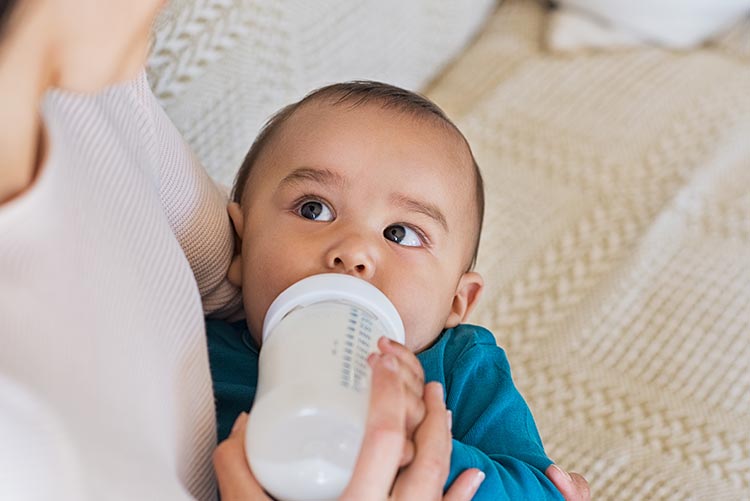 A baby feeding on milk.