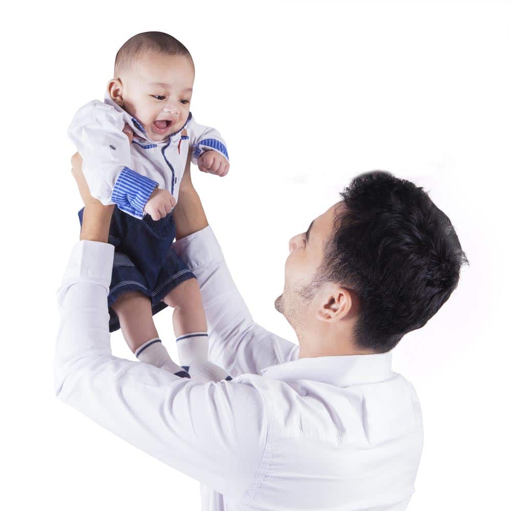 Father lifts his baby up joyfully!