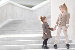 Two girls holding hands