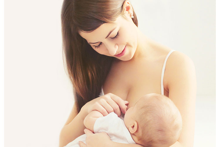 Woman breastfeeding her child.