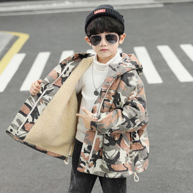 Young boy wearing a multicoloured full sleeves camo printed coat.