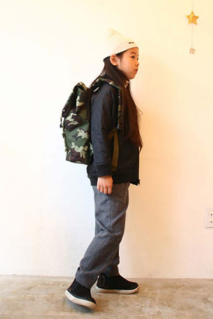 Young girl carrying a Camo bag!