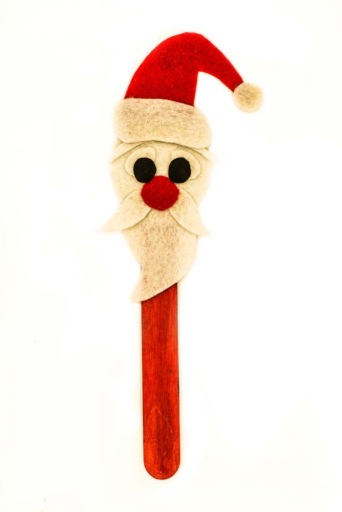 An ice cream stick has been used to make a Santa Claus bookmark!
