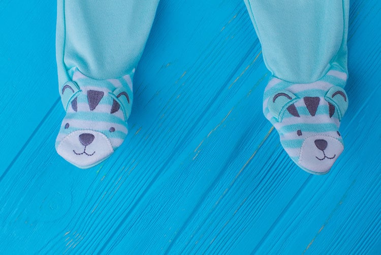 A footie with cute bear appliques at the feet.
