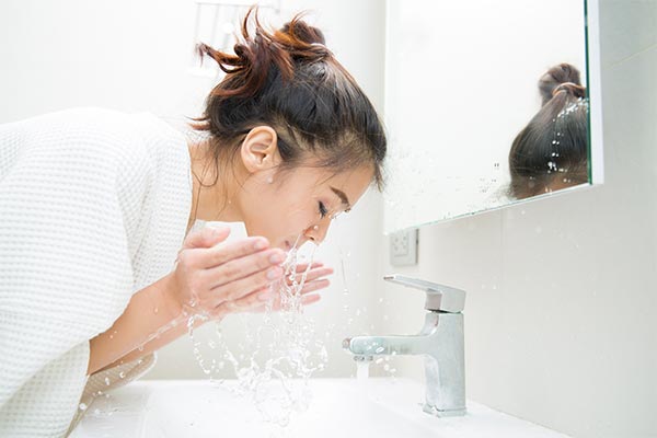 A day cleansing her face for a Face Clean Up.