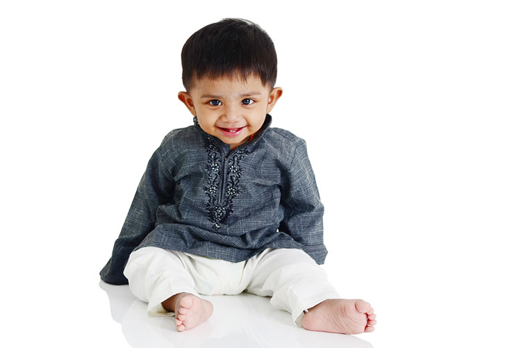 Adorable Indian boy smiling at the camera