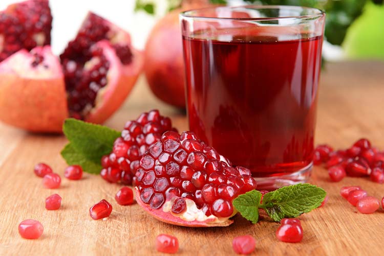 A glass of pomegranate juice.