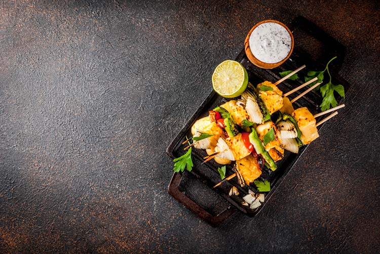 Indian style paneer tikka with sesame seeds.