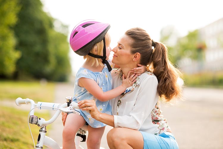 A mother adores her daughter.