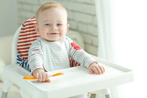 A smiling baby boy.