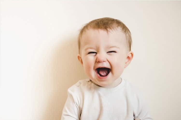 Adorable toddler laughing heartily!