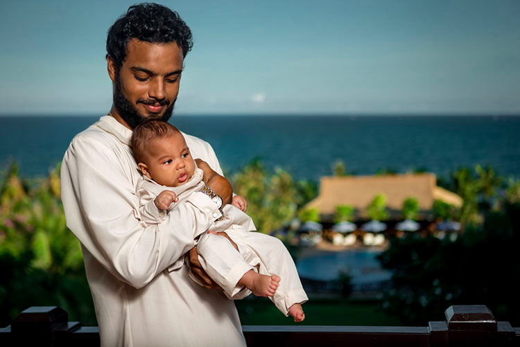 Father holding his newborn baby.