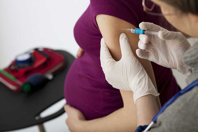  Pregnant woman getting shots