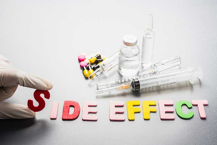 Letters spelling ‘Side effect’ next to syringes and tablets