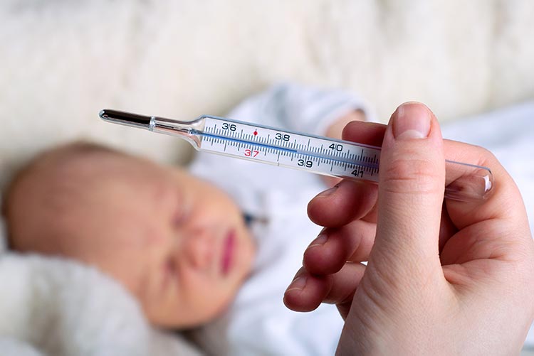 A young baby running a temperature.