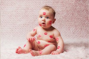 A baby showered with kisses!
